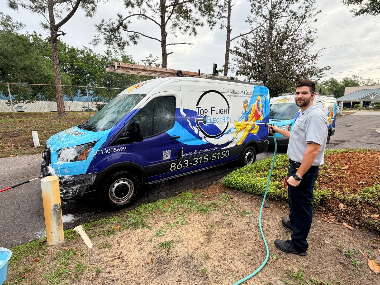 Top Flight Electric technician with a branded service van