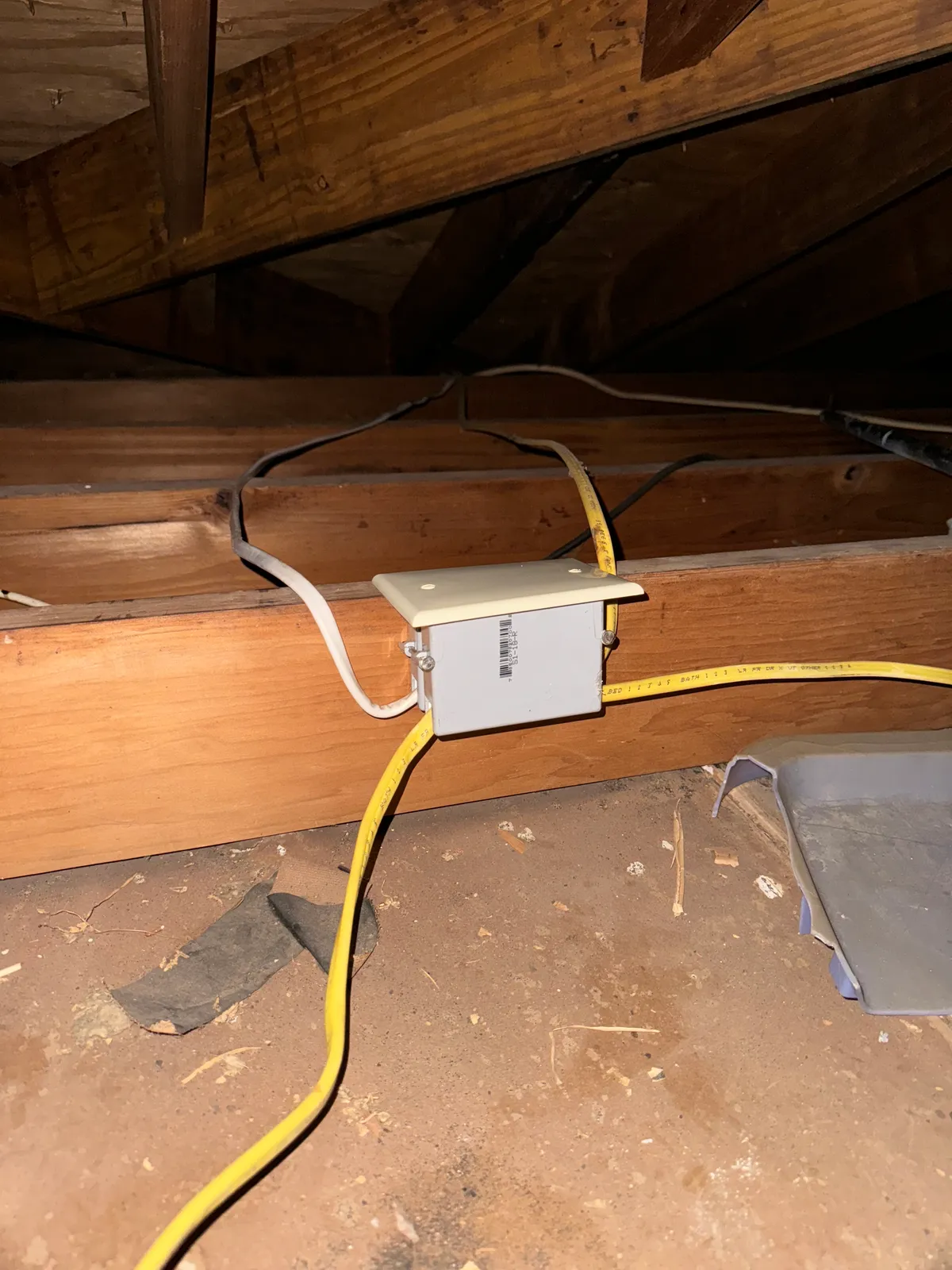 New junction box and circuit wiring run through an attic
